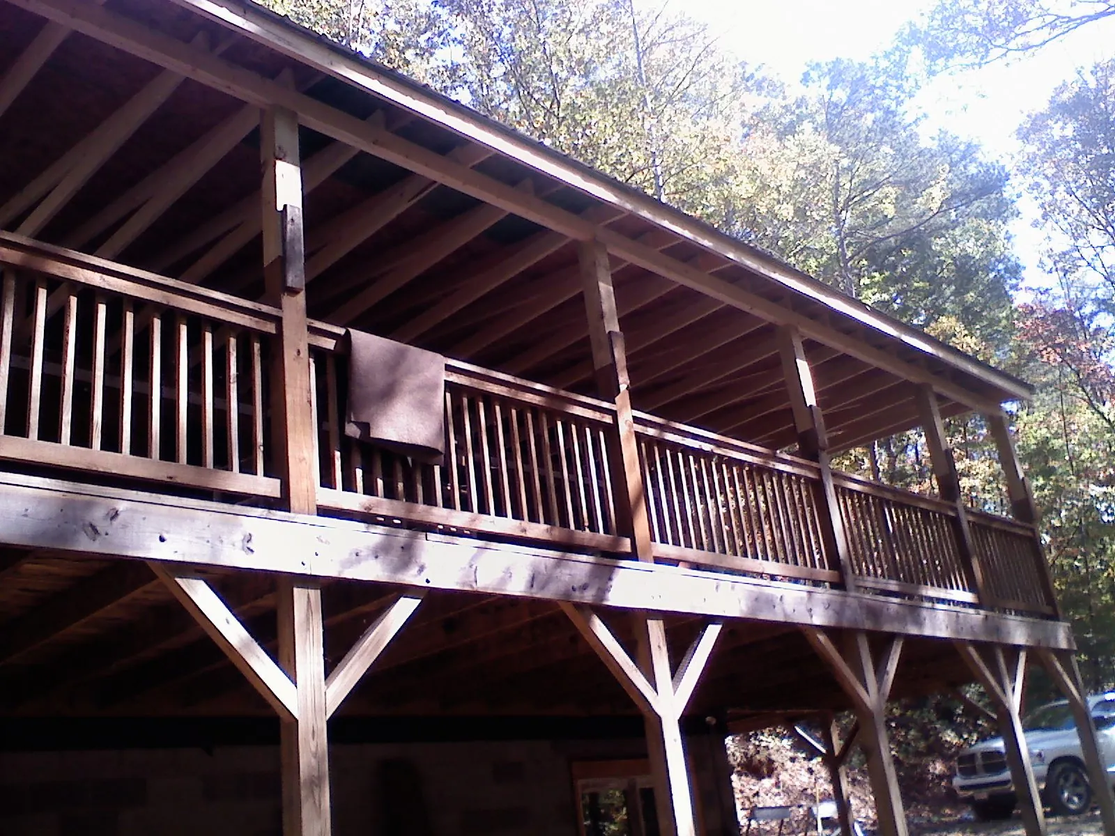 Timber framing under a new elevated porch and deck — Roof Leak Repair in Mad River by Roofing Brothers